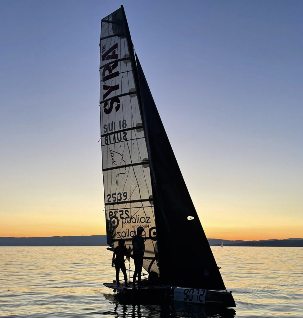 Syra-foilers by sunset sailing on the lac leman, showing off speed and foiling